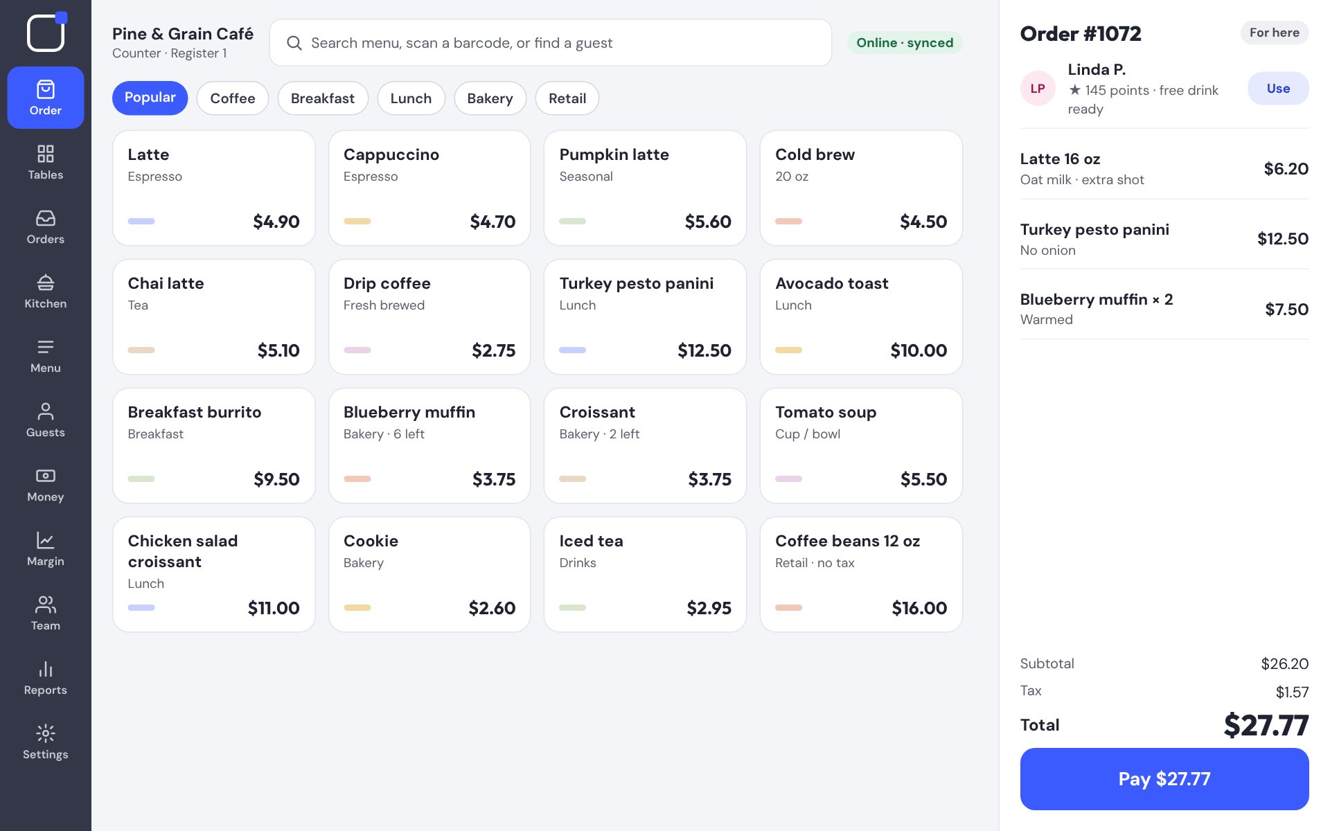 Friendly POS register taking a café order
